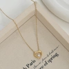 A large heart-shaped pendant with a hollow texture and a small heart embedded inside has a golden texture and a romantic atmosphere Item Picture